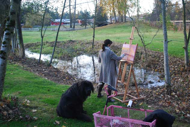Susan painting on her farm